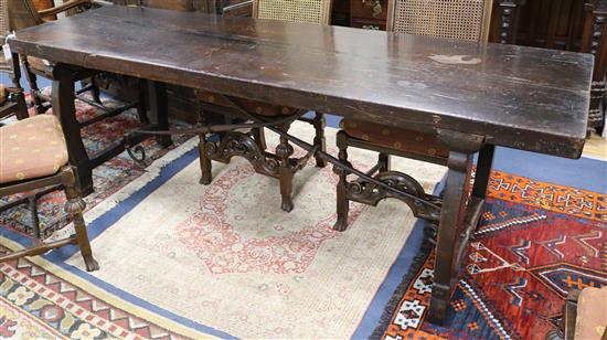 A 17th/18th century Spanish heavy walnut refectory table W.234cm